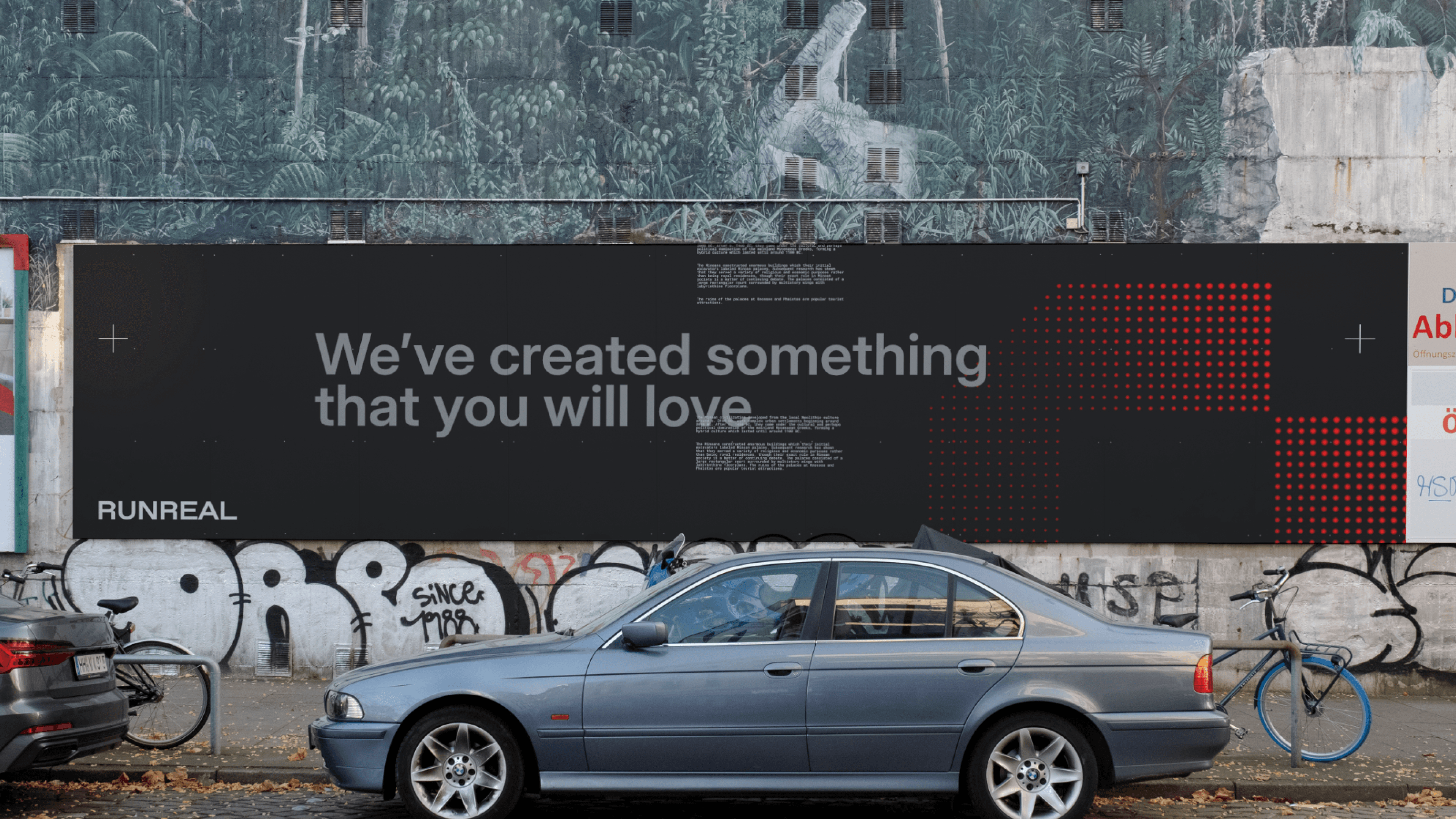 Urban billboard mockup for Runreal with the headline “We’ve created something that you will love” on a dark background with red data-like dots, designed by Kundo Studio to showcase the tech-forward brand identity and out-of-home campaign.}