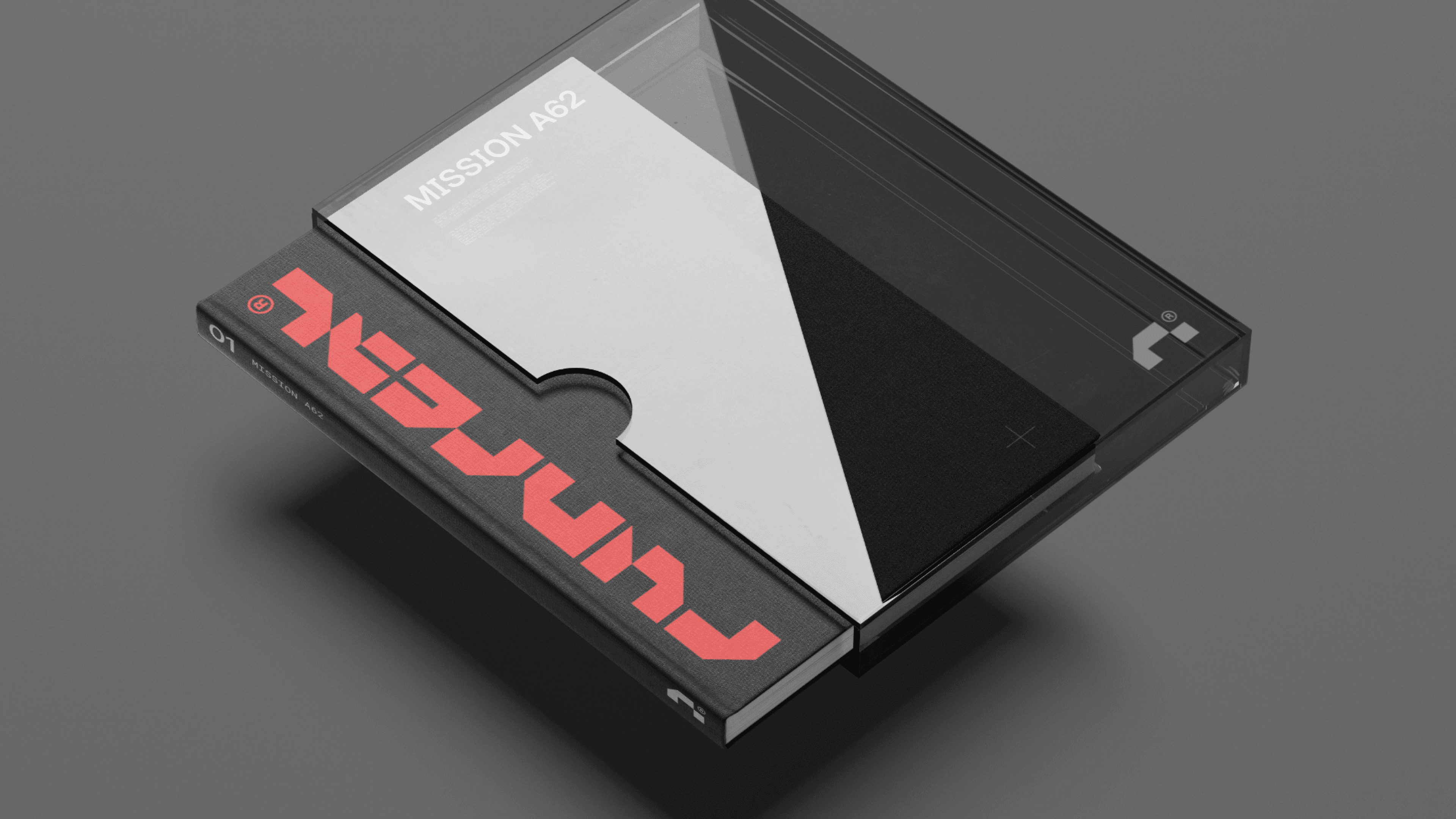 Minimal 3D mockup of a Runreal “Mission A62” book and clear case with bold red wordmark, designed by Kundo Studio to showcase the tech-forward brand identity, print design, and packaging system.