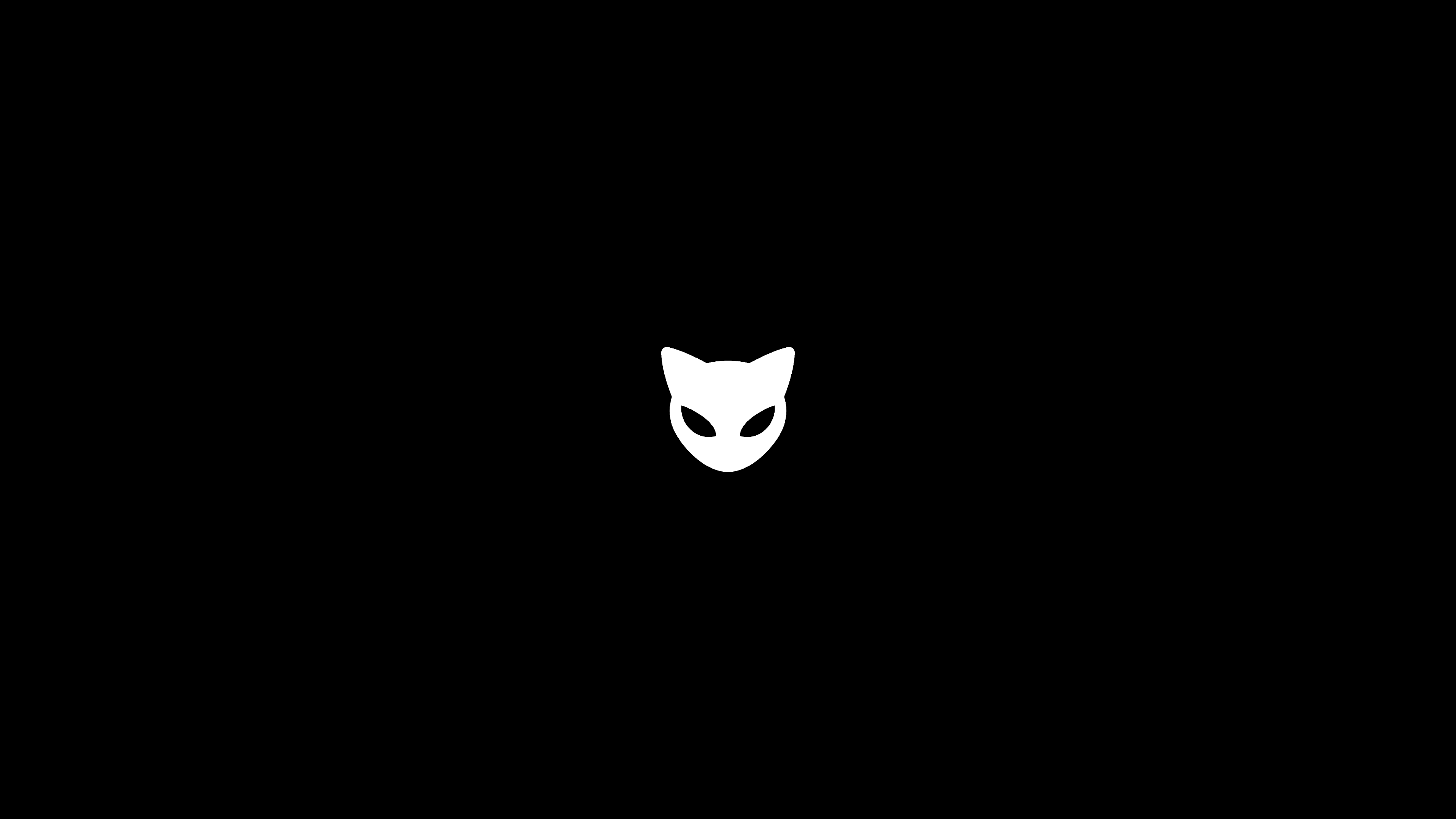 Centered white MEOW cat-head logo on a black background, designed by Kundo Studio as the core playful icon for the MEOW crypto brand and retro-inspired website.